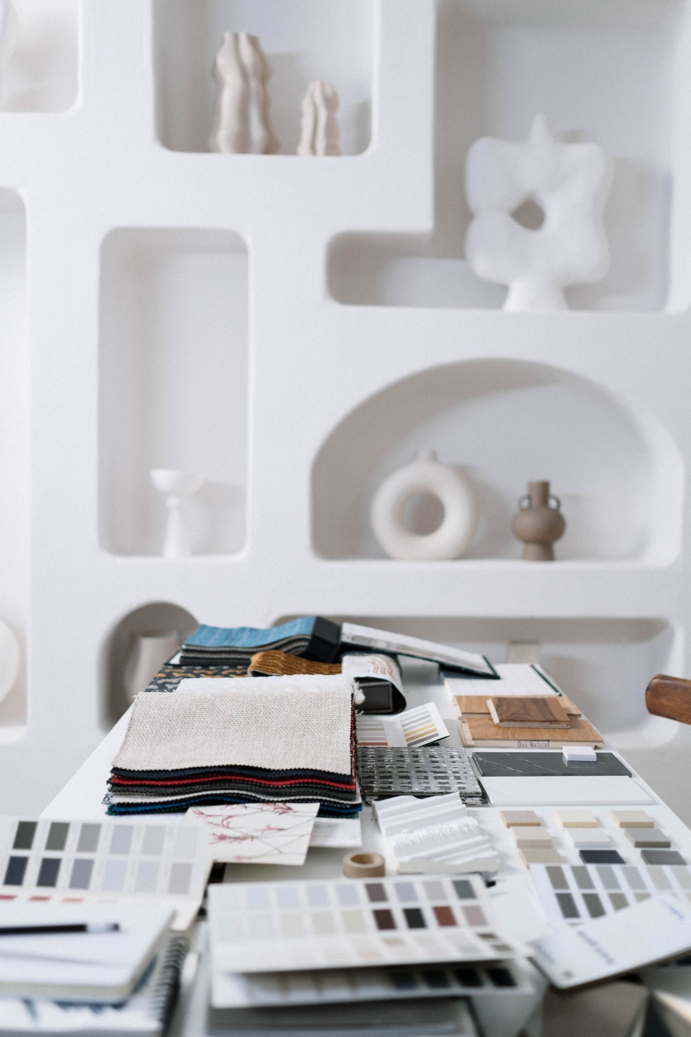 Interior design materials, samples and finishes arranged on a worktable